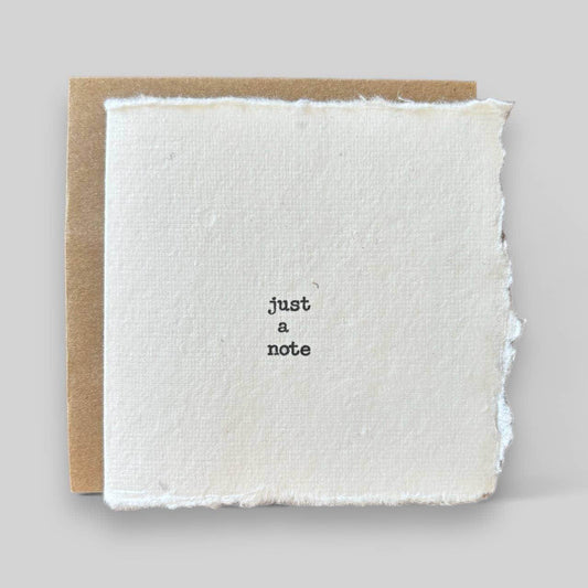 Small white handmade typewritten just a note card - Songbird Gifts